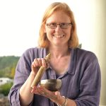 Pamela playing small brass singing bowl